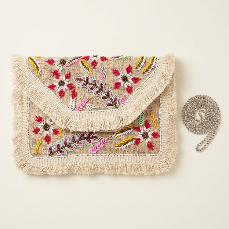 Ivory floral beaded fringe clutch, AI-generated studio image