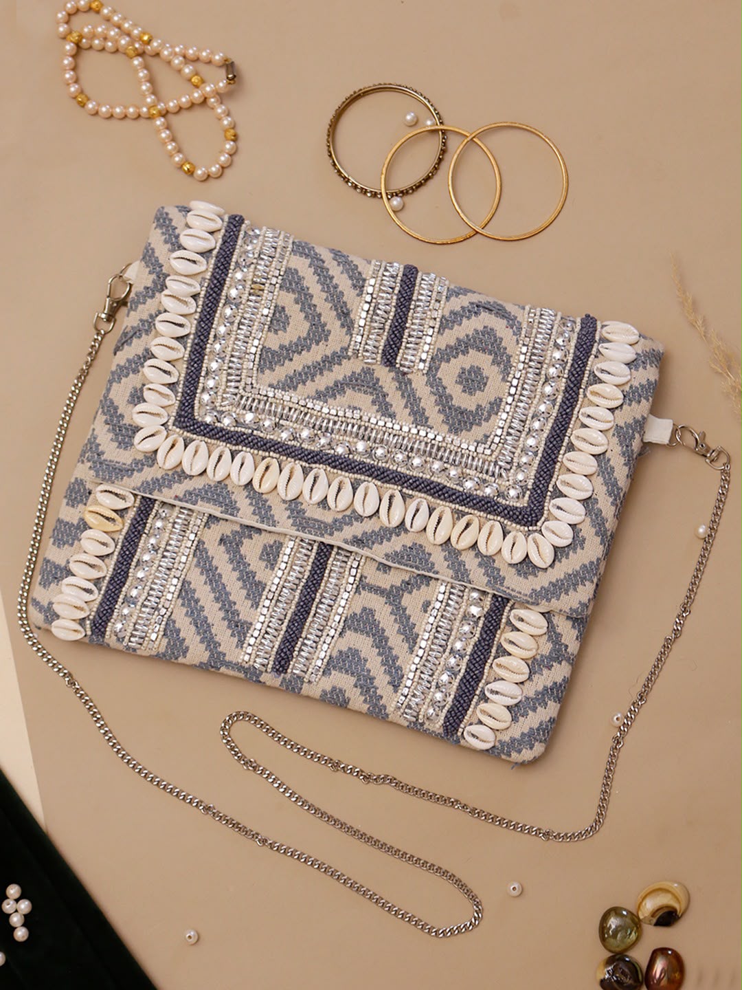 Original Cove ivory and grey geometric bag with cowrie-shell trim