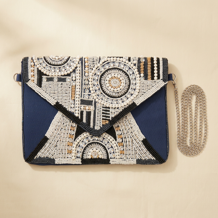Navy geometric beaded envelope clutch with silver chain, studio image