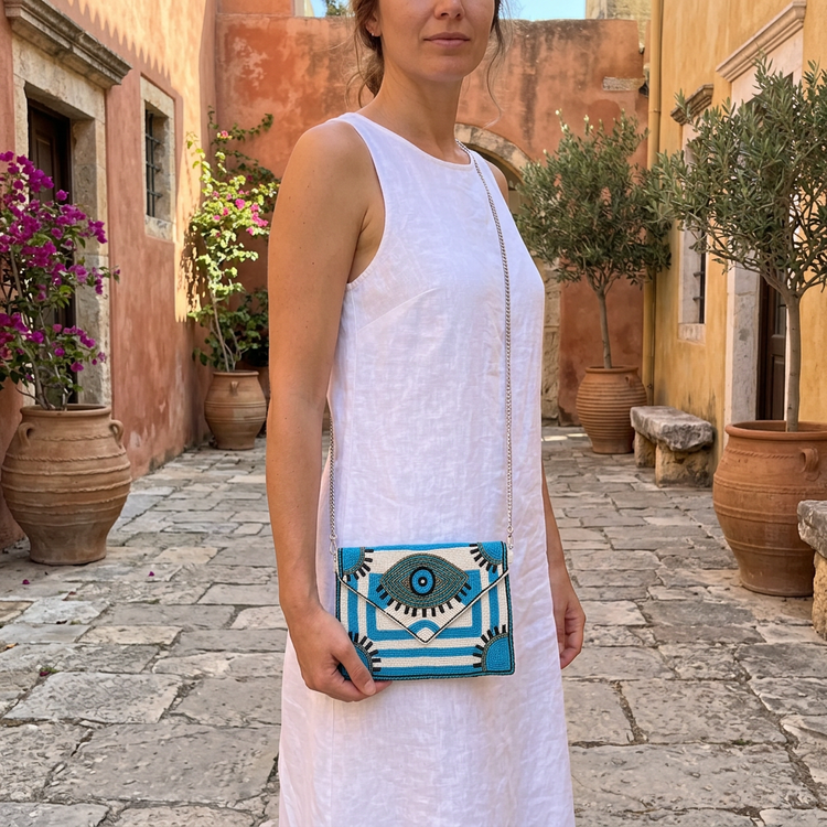 Small turquoise and white eye clutch with white linen, corrected-scale AI-generated lifestyle image