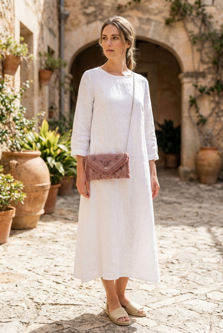 Digitally generated dusty rose clutch styled with white linen