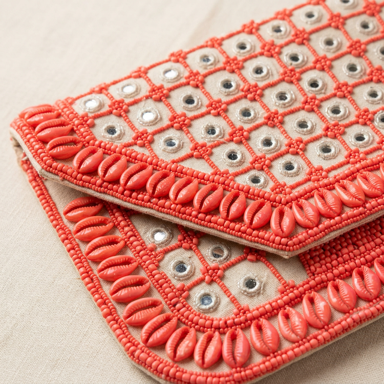 Detail of coral shell-shaped trim, beaded grid and mirror accents
