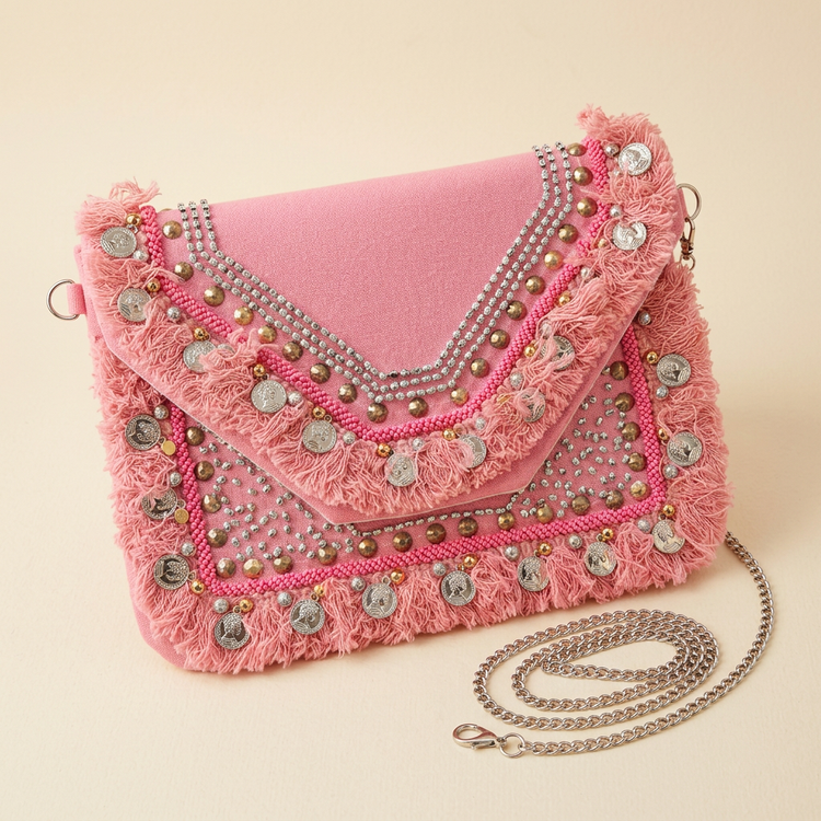 Rose pink stud and coin fringe clutch, AI-generated studio image