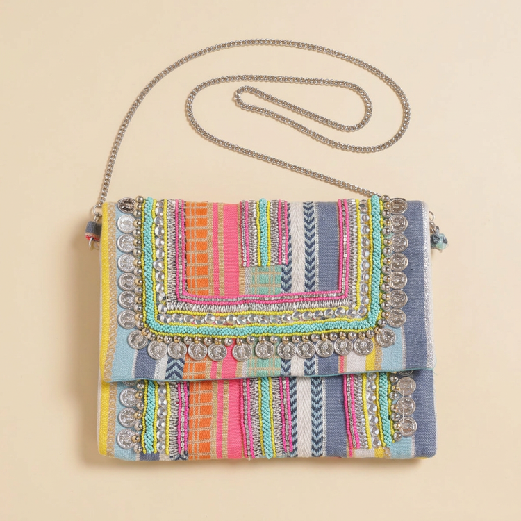Candy Coast striped boho bag on cream studio background