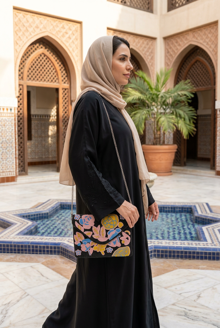 Noor black floral bag styled with black abaya