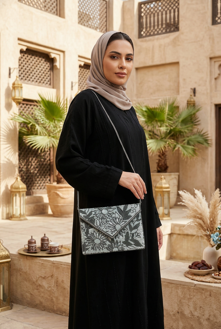 Moonlit Bloom compact floral bag styled with black abaya