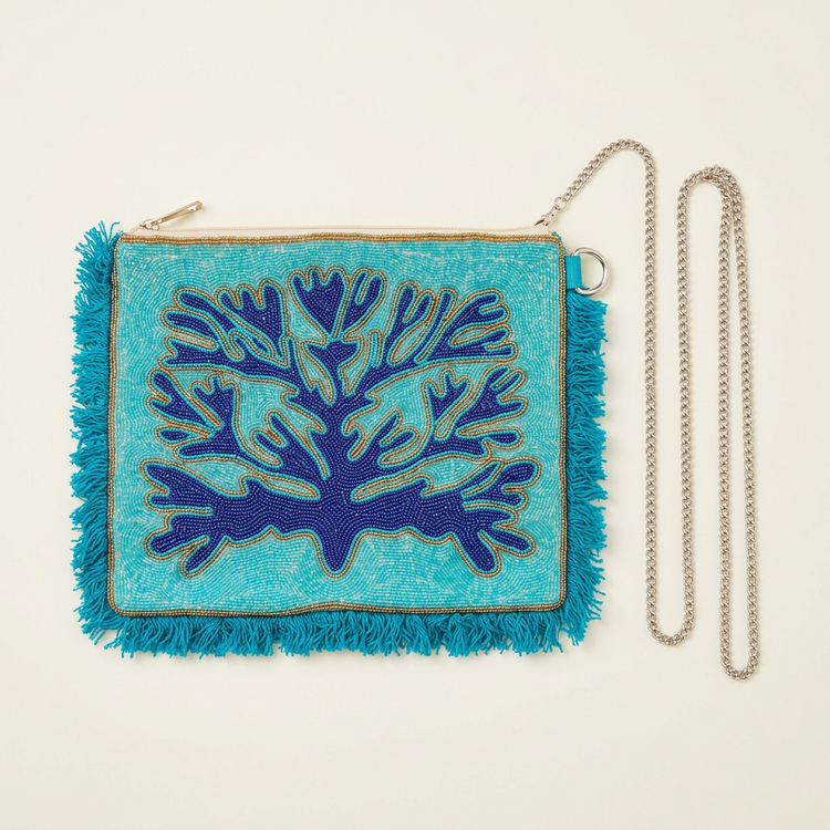 Turquoise and navy coral beaded fringe clutch, AI-generated studio image
