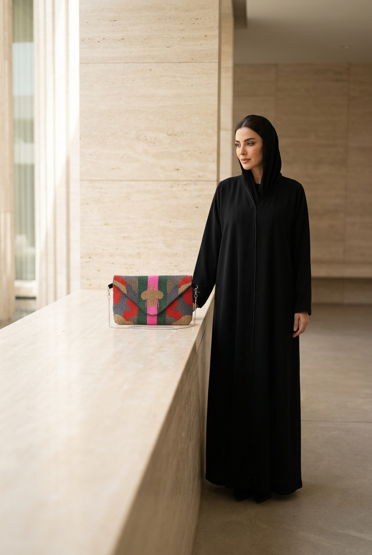 City Muse bag styled with black abaya