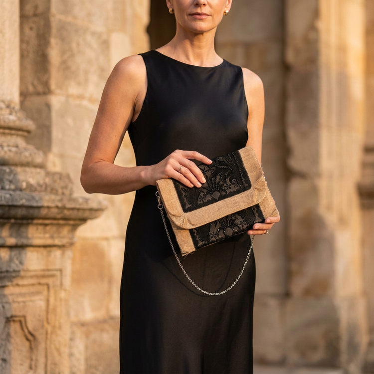 Small black and beige clutch styled with a black dress and silver chain, AI-generated lifestyle image