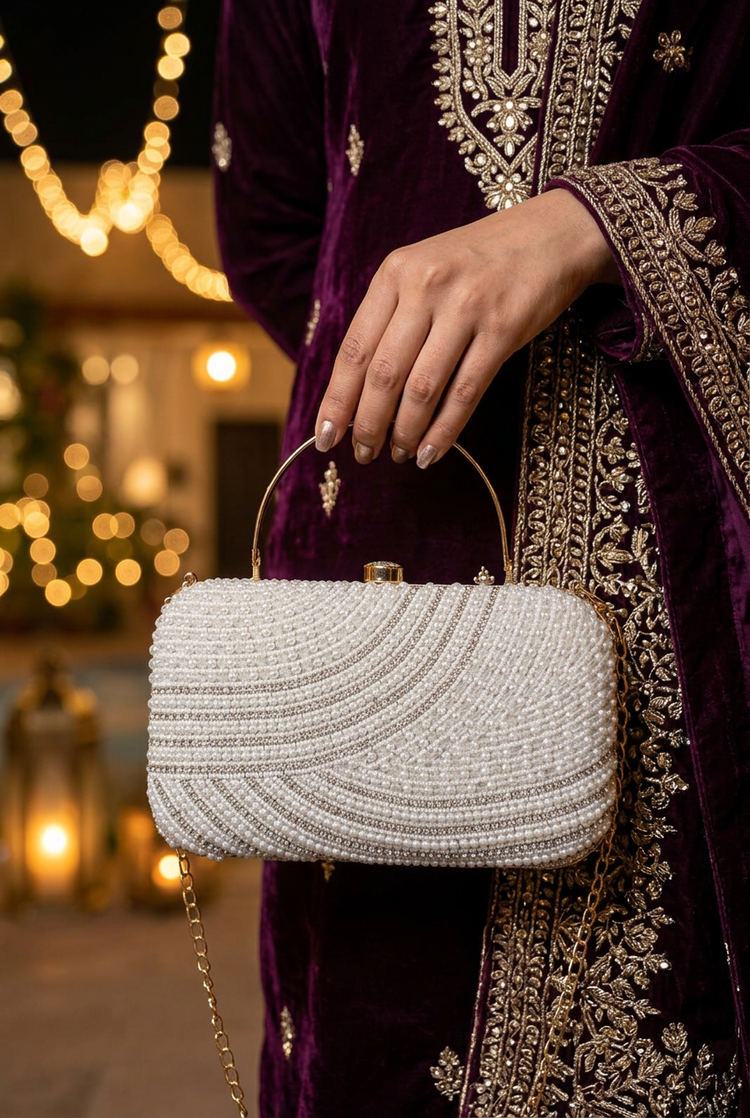 Satin Current Silver wave beaded clutch at a festive celebration