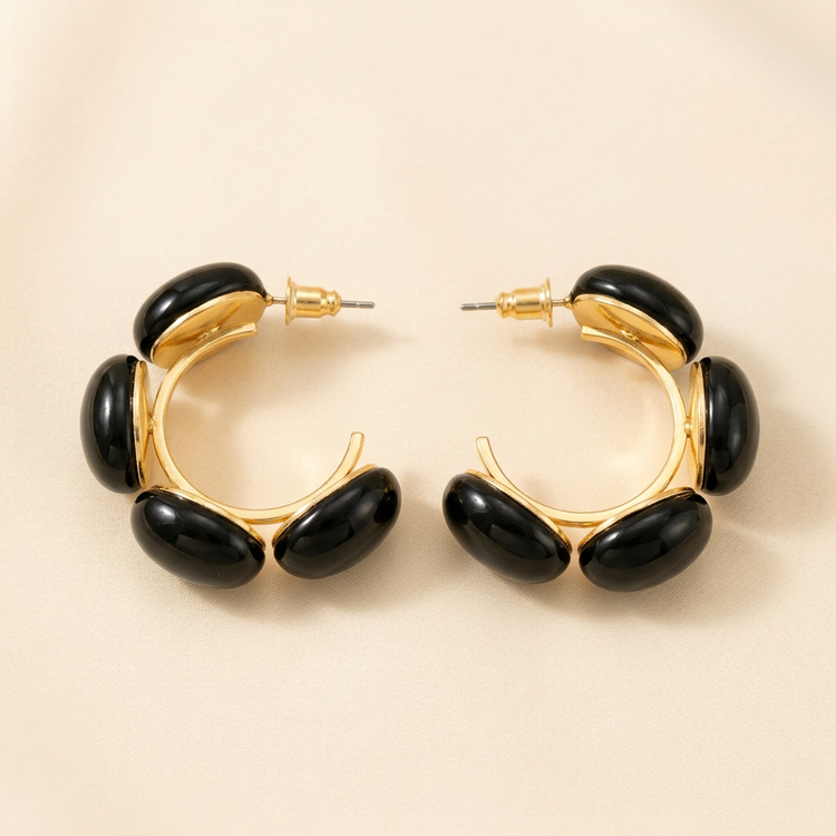 Black Pebble Gold Hoop Earrings studio shot on cream