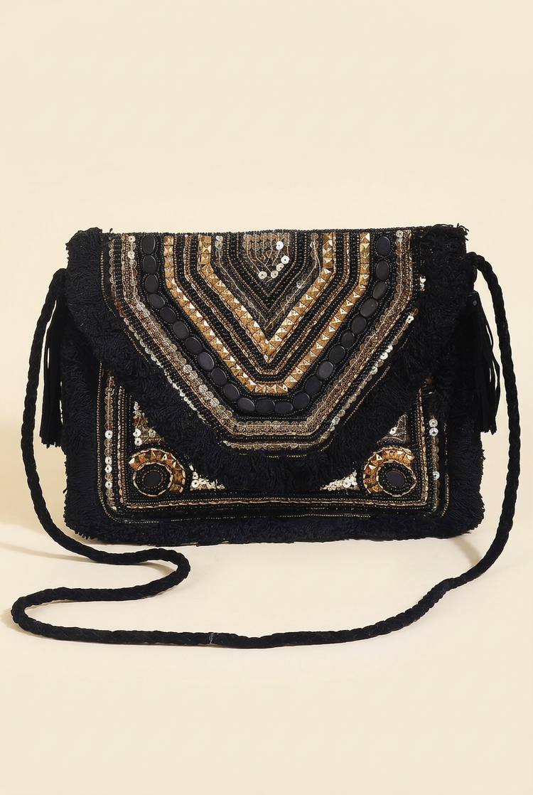 Black Chevron clutch with black braided fabric strap, studio