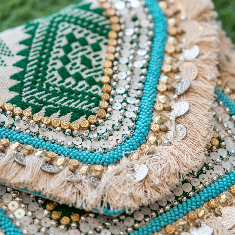 Turquoise beads green weave and coin fringe, AI-generated detail image