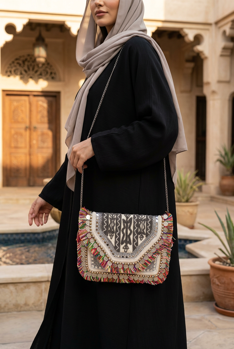 Sahara geometric fringe bag styled with black abaya