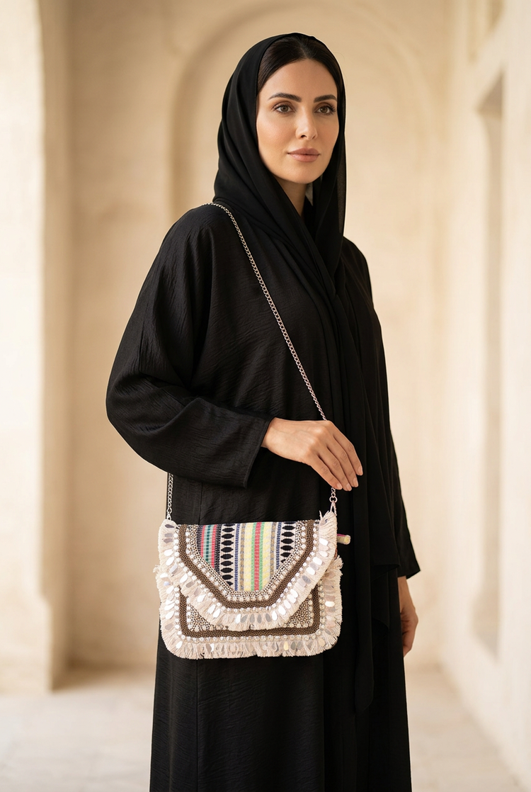 Festival Shine bag styled with black abaya