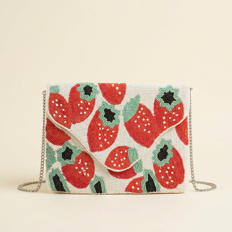 Fraise strawberry beaded bag on cream studio background