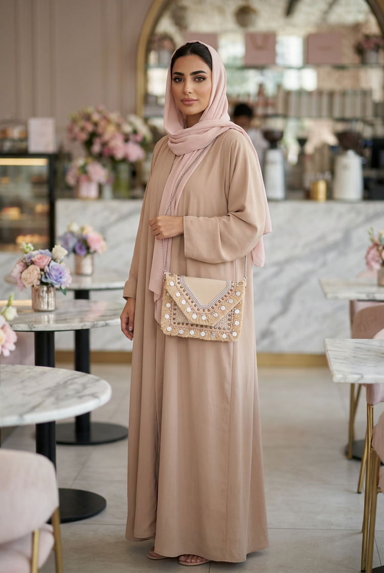 Blush beige coin and fringe boho clutch on a chain with a nude-beige abaya and blush shayla in a pastel café