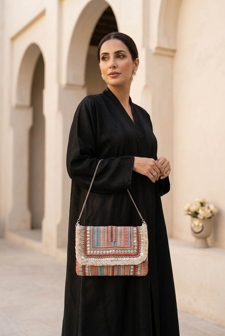 Desert Stripe clutch styled with black abaya