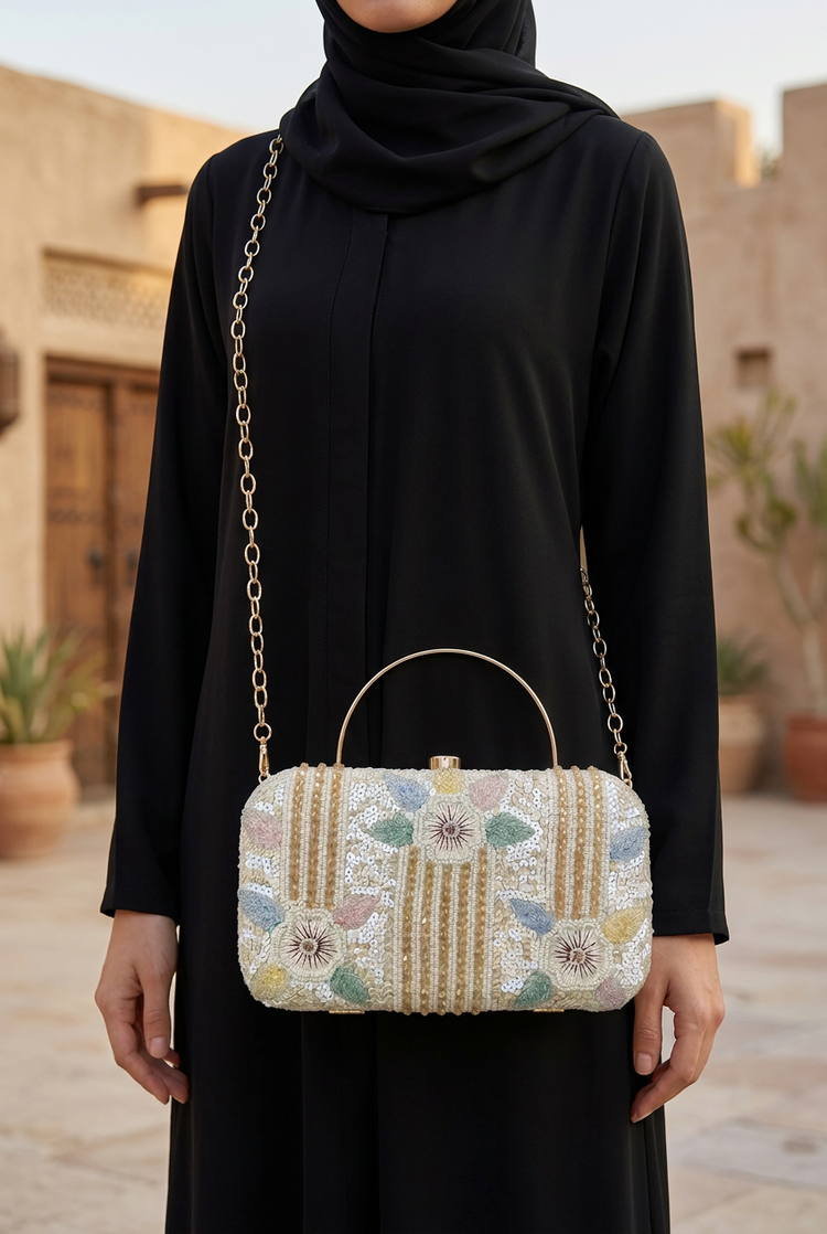 Pastel Bloom sling bag worn with a black abaya