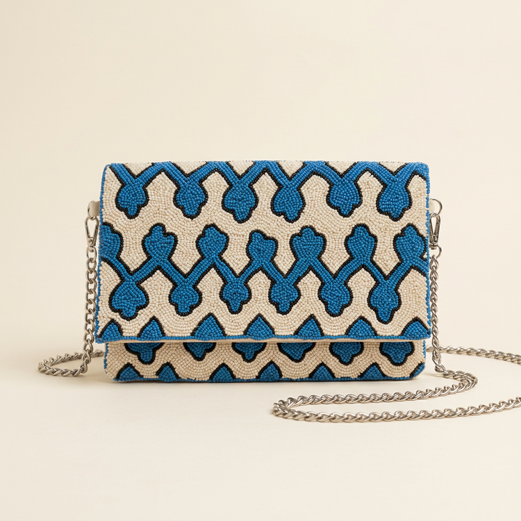 Azura blue geometric beaded bag on cream studio background