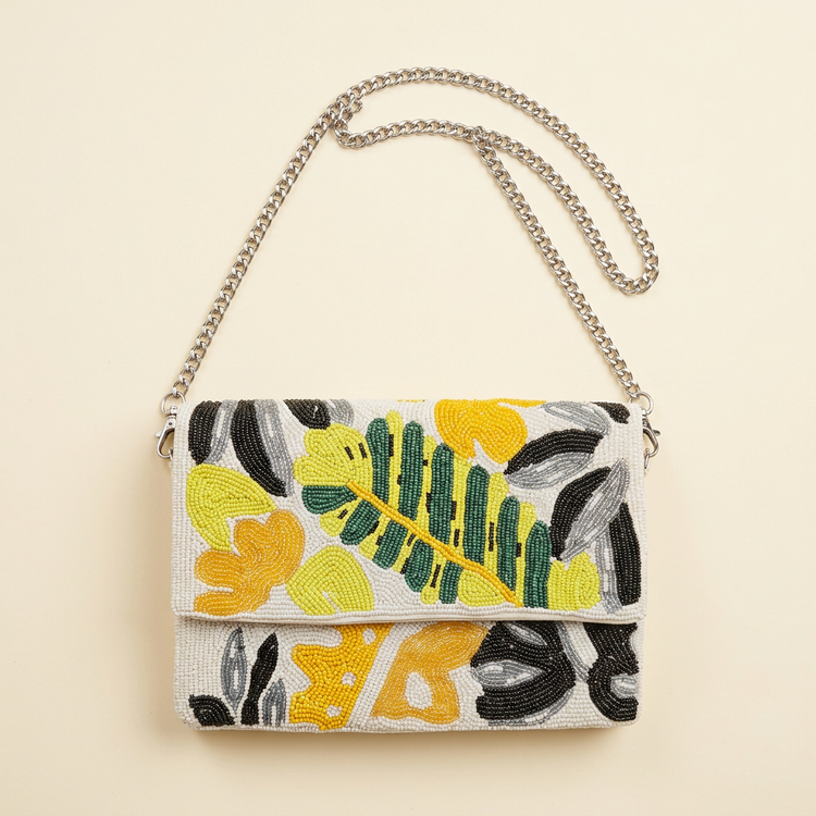 Paloma botanical beaded bag on cream studio background