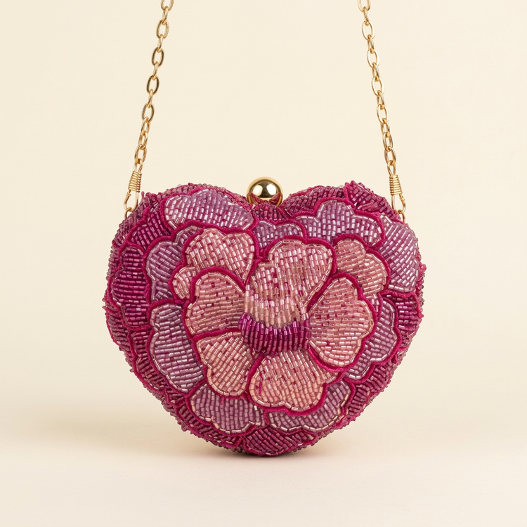 Pink floral beaded mini bag with gold-tone chain, studio view