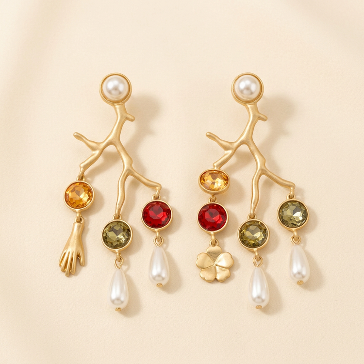 Gold Coral Branch Charm Earrings studio shot on cream